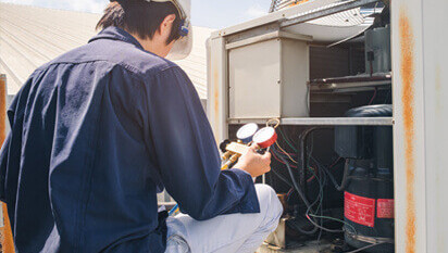 HVAC Technician Installing Commercial HVAC System