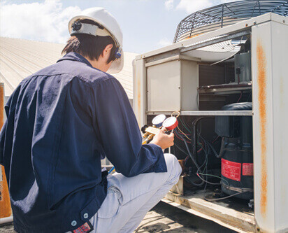 HVAC Technician Installing Commercial HVAC System