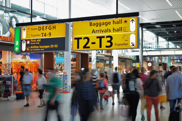 people traveling busy airport